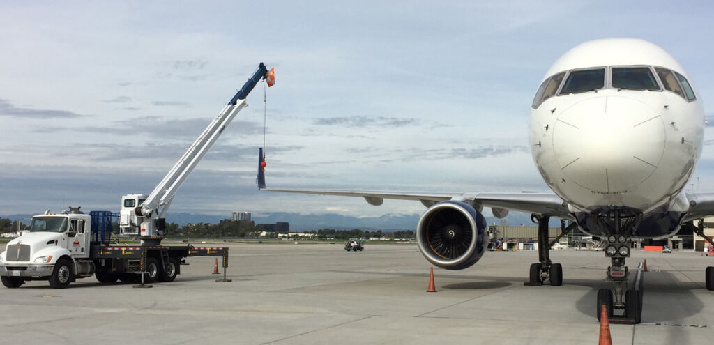 Crane lifting an airplane
